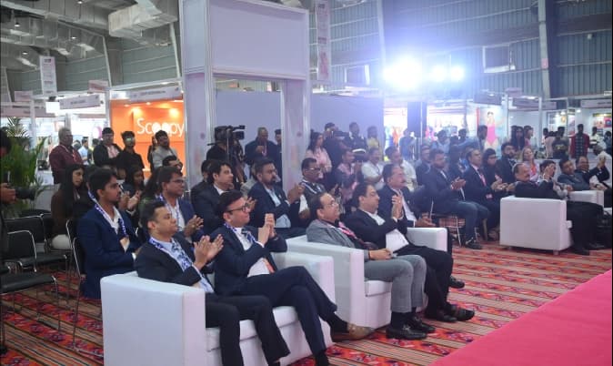 Visitors examining fashion items